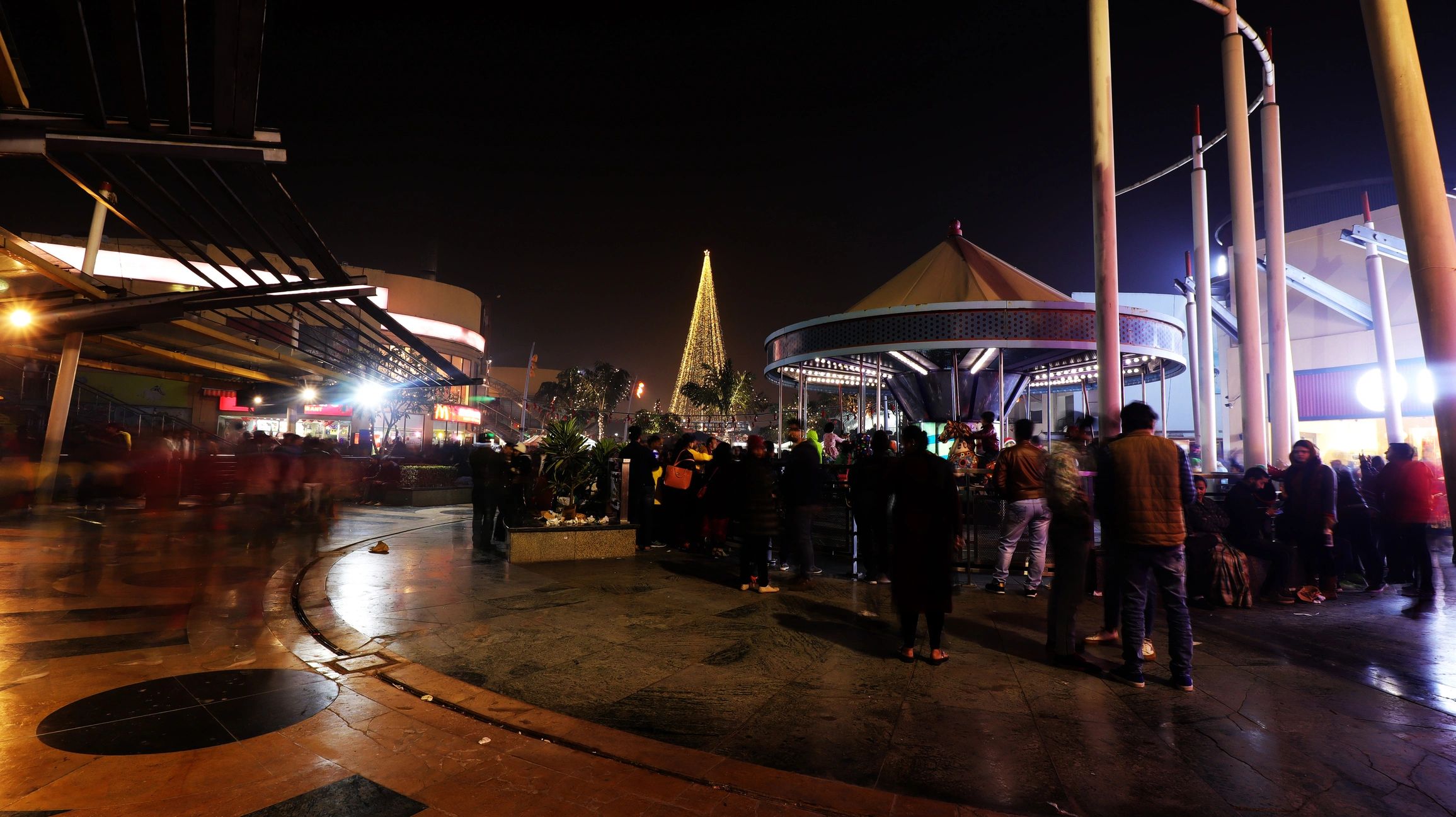Nighttime festival scene at an amusement park