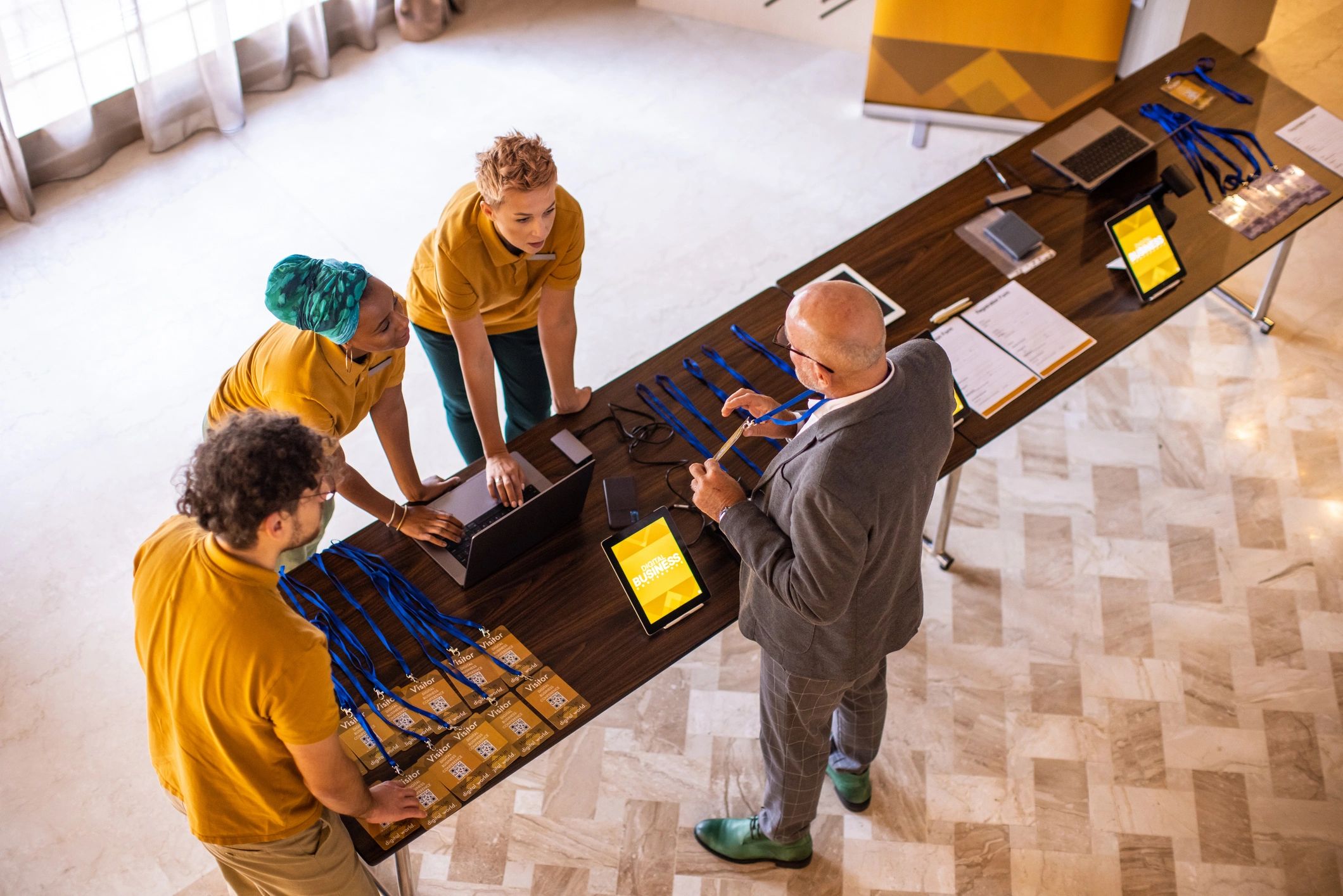 Conference registration desk in a luxury hotel lobby