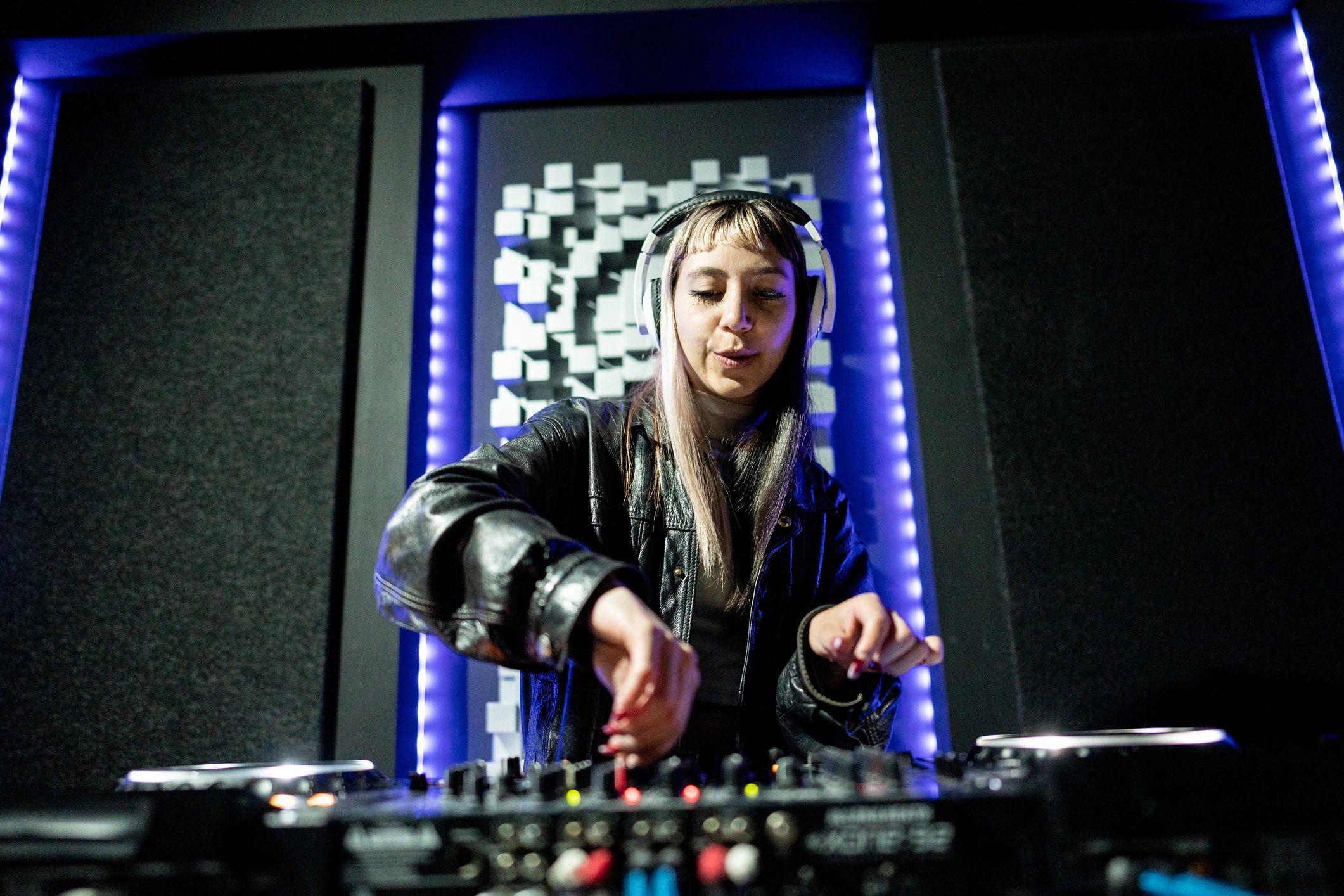 DJ performing at an event representing entertainment programming