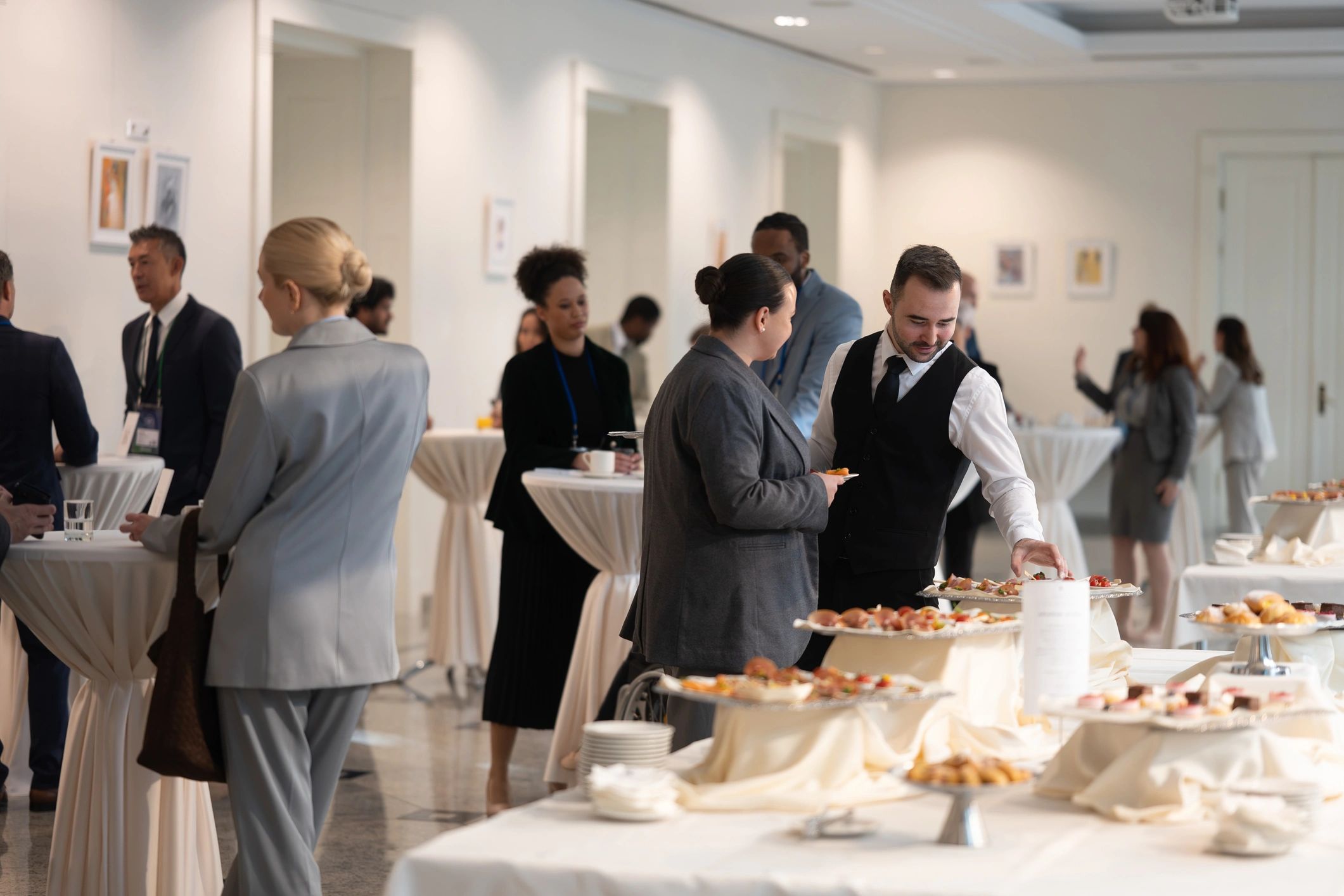 Catering staff serving guests at a reception representing hospitality coordination