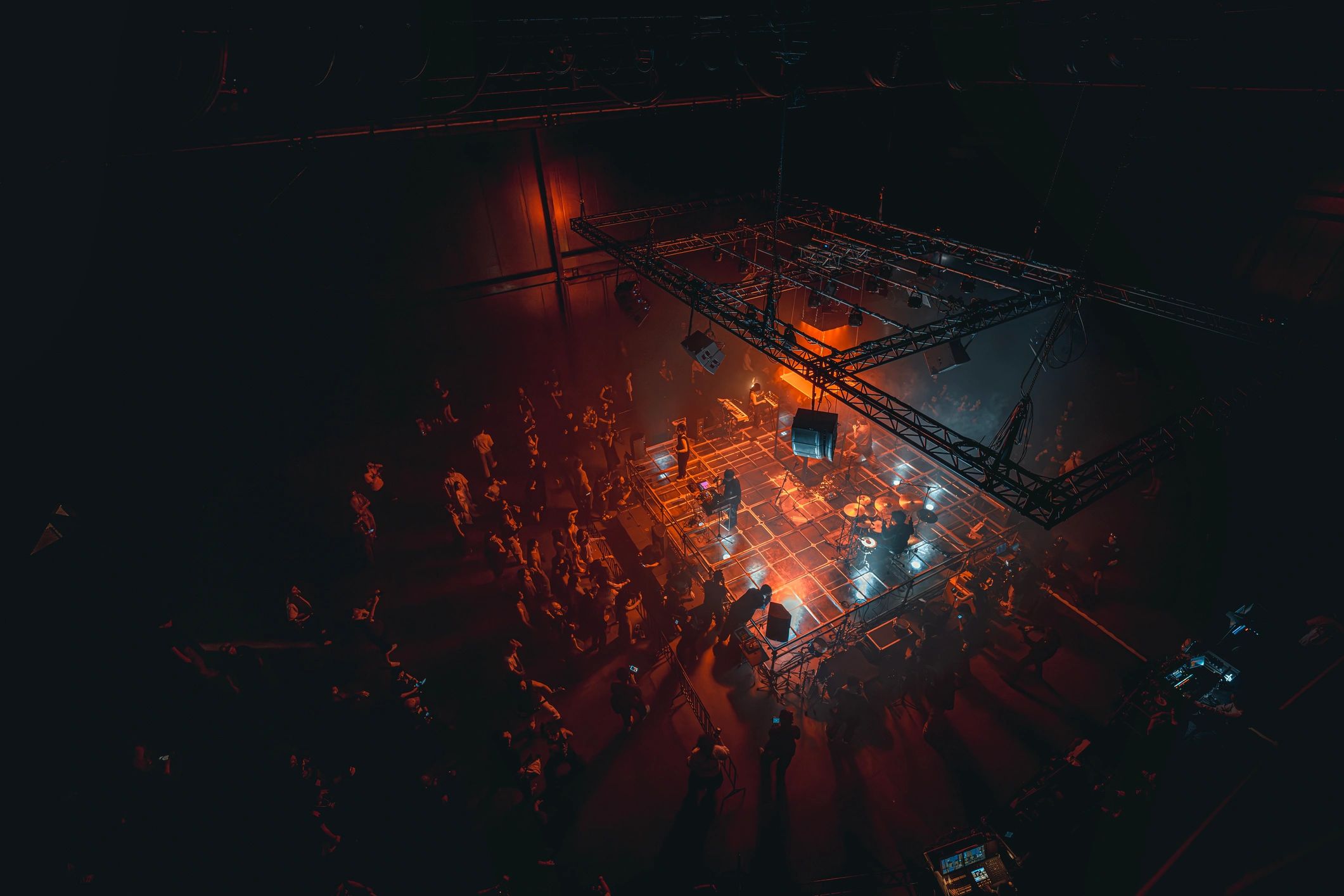 Live musicians performing on a stage with colorful lighting